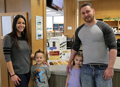 Family posing in library. 