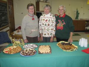 Friends serving delicious treats at a library event