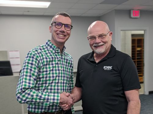 Scott shakes hands with Denny