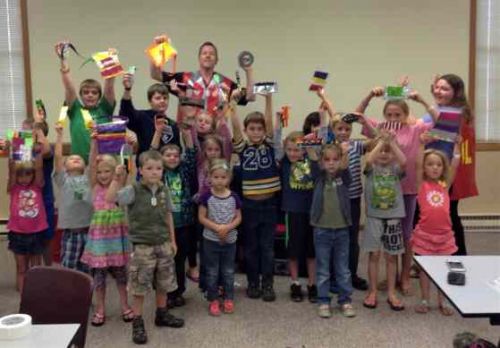 Kids pose during a library event. 